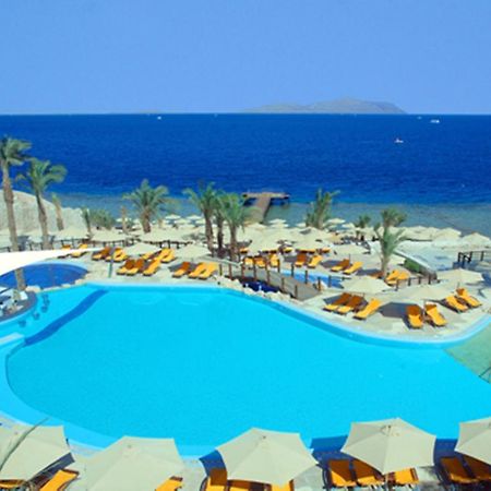 Xperience Sea Breeze Resort Sharm el-Sheikh Exterior foto A swimming pool at a resort in Egypt