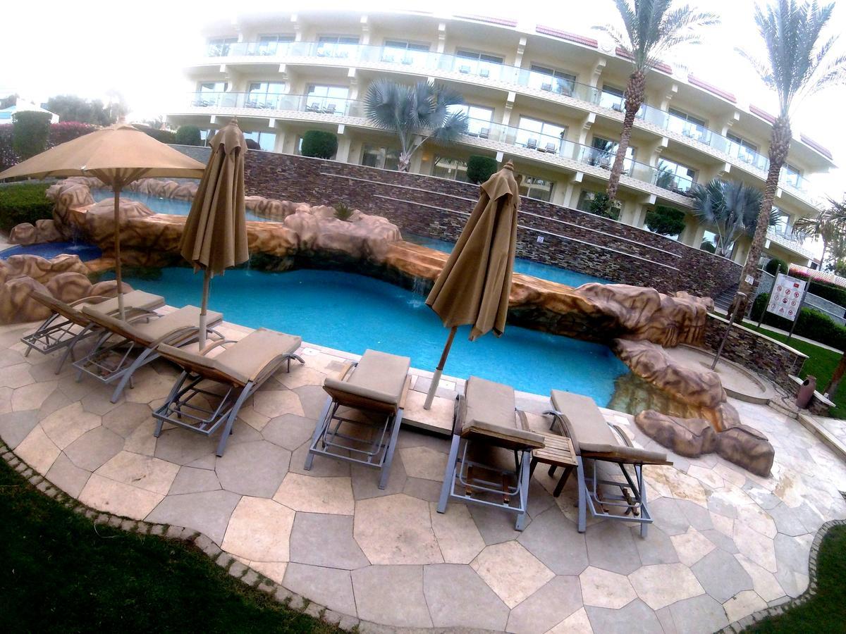 Xperience Sea Breeze Resort Sharm el-Sheikh Exterior foto The pool at the Royal Mirage