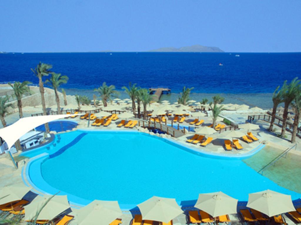 Xperience Sea Breeze Resort Sharm el-Sheikh Exterior foto A swimming pool at a resort in Egypt